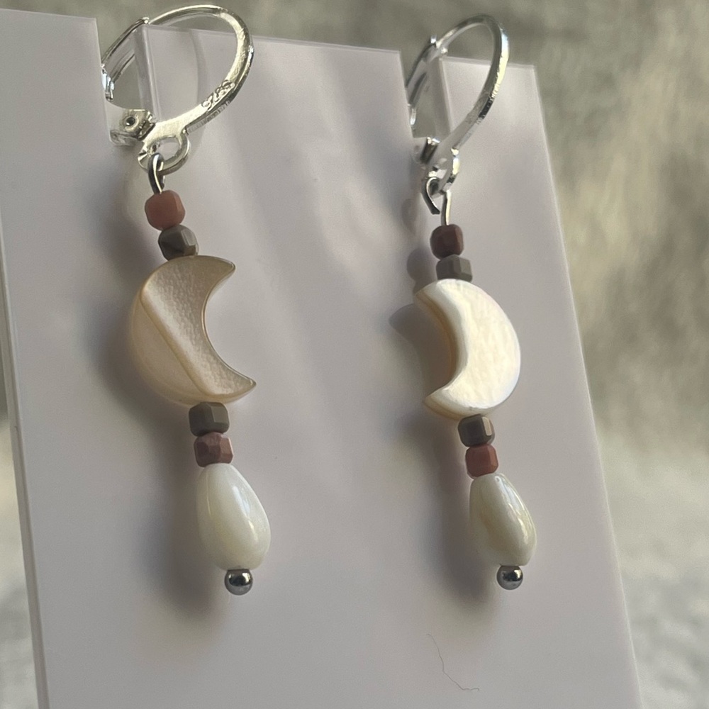 Natural shell, and mother of pearl light catching earrings. 925 silver hooks.